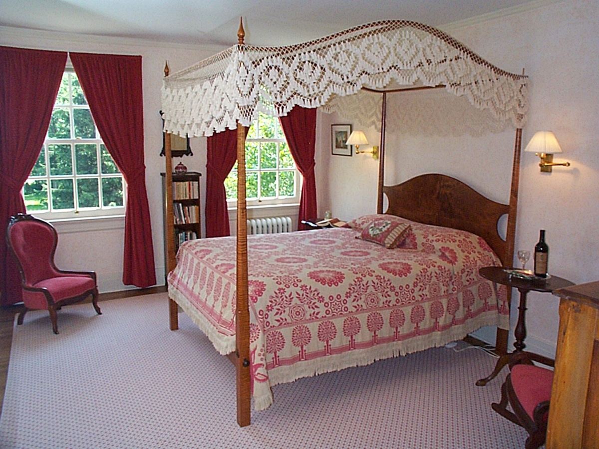 Elisabeth Willcox Suite bedroom with tiger maple canopy bed